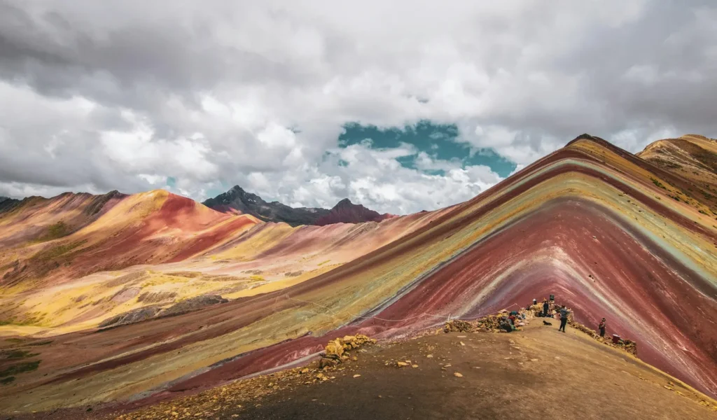 Riders on foot on the final walk to the Rainbow Mountain viewpoint at over 5,000 m
