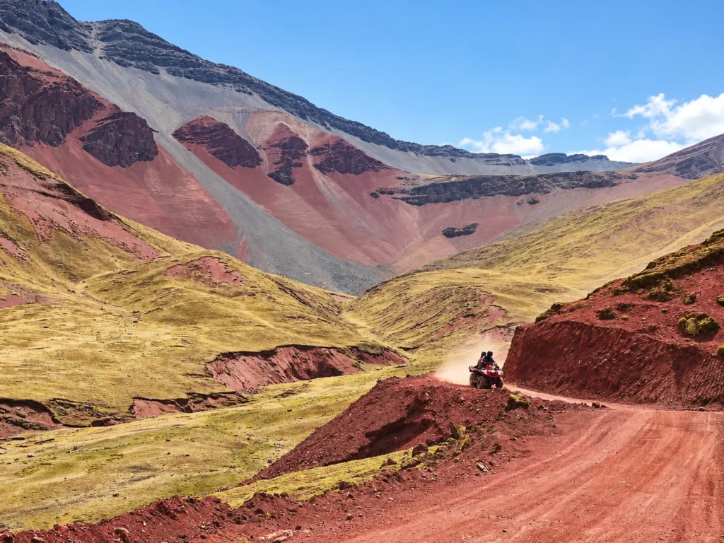 ATV riders crossing the high plains above 4,500 m on the way to Rainbow Mountain — is ATV Rainbow Mountain safe for first-timers